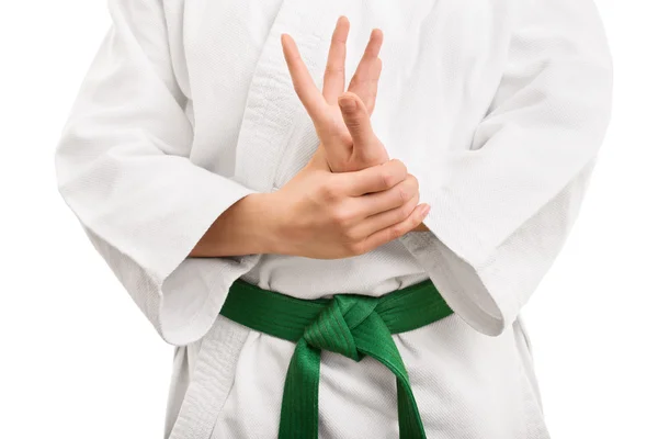 Young girl in kimono stretching her hand — Stok fotoğraf