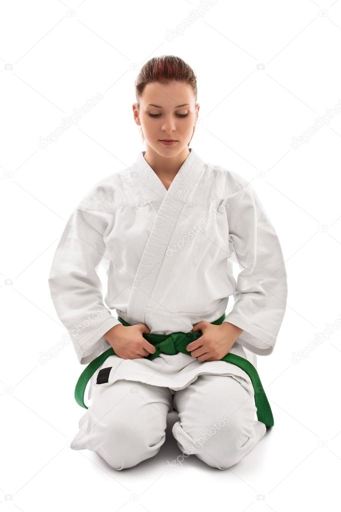 Young girl wearing kimono in meditative stance