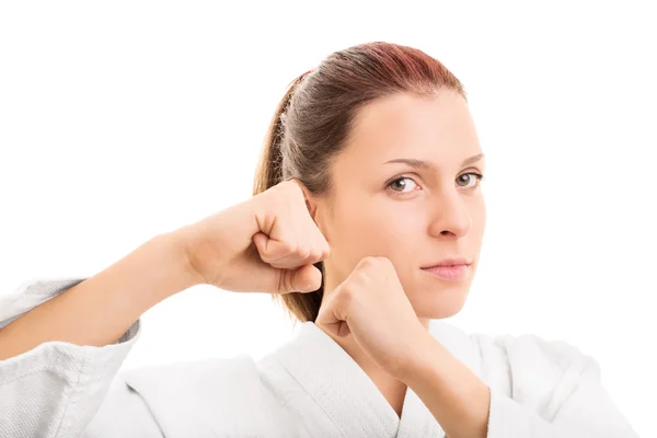 Jong meisje met haar vuisten omhoog — Stockfoto