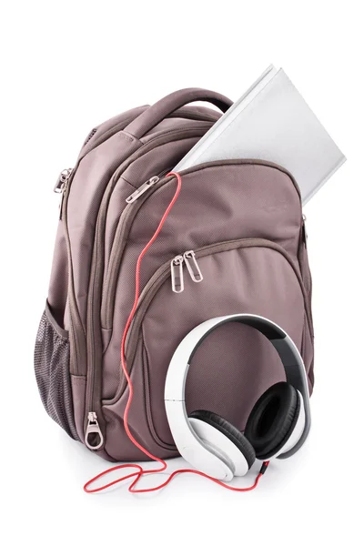 Backpack with headphones and notebook — Stock Photo, Image