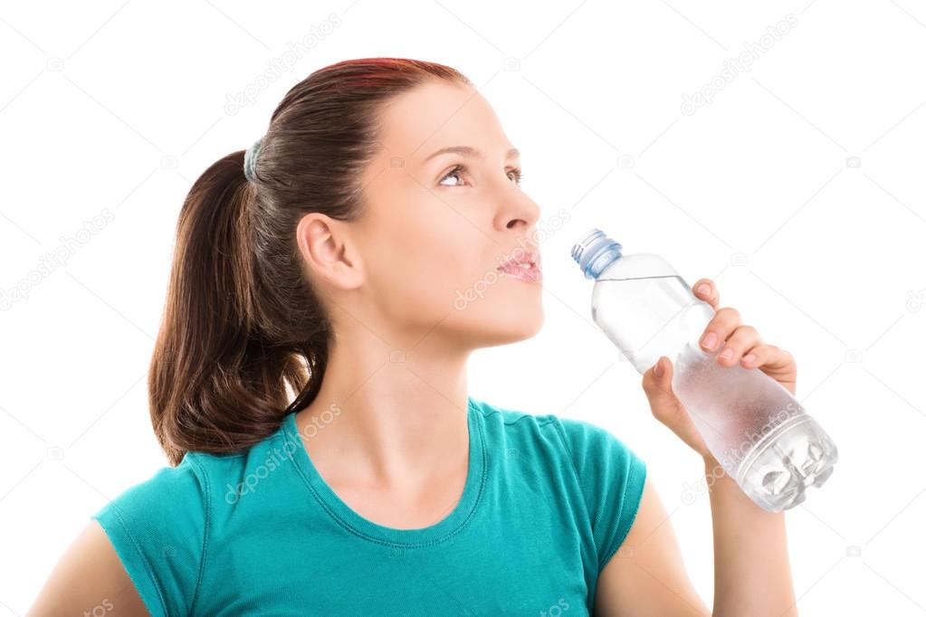 Young girl drinking water