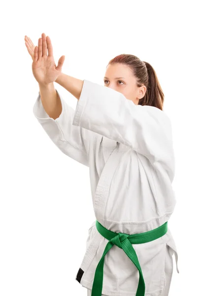 Chica en kimono haciendo un bloque — Foto de Stock