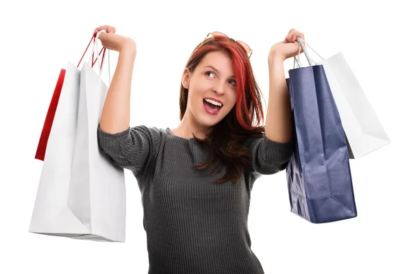 Young girl with shopping bags isolated on white background — Stock Photo, Image