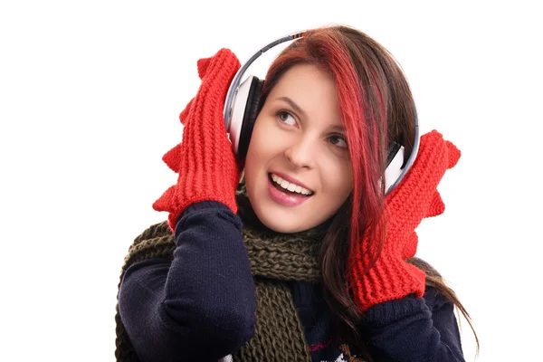 Portret van een jong meisje met winterkleren en hoofdtelefoons — Stockfoto
