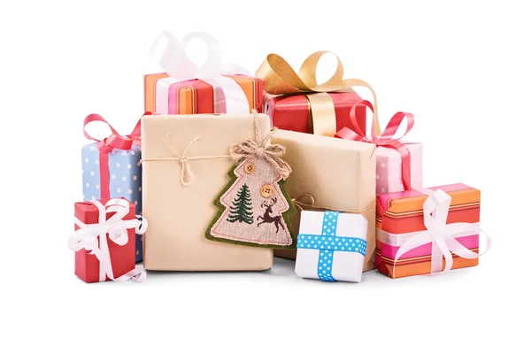 Pile of christmas gifts on white background — Stock Photo, Image