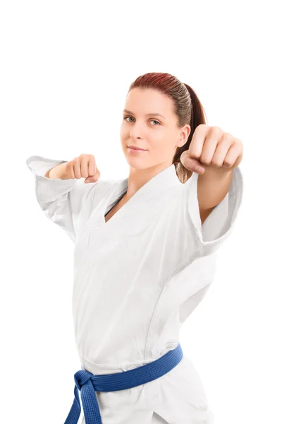 Beautiful young girl in a kimono punching — Stock Photo, Image