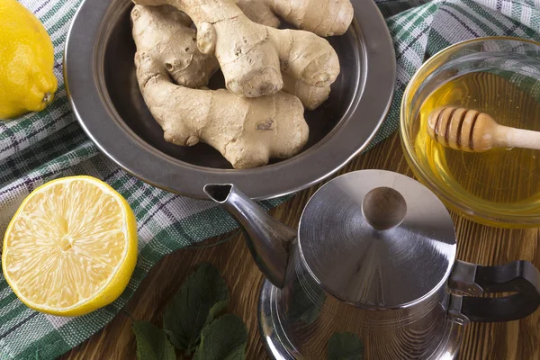 Teapot of ginger tea with honey and lemon. — Stock Photo, Image