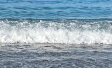 The sea on a clear day. Wave off the coast.