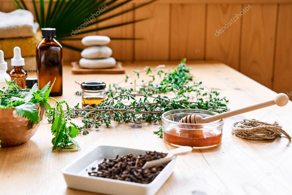 Medical herbs, different types of oils and essences on the table. Aromatherapy and alternative medicine concept. Natural remedies.