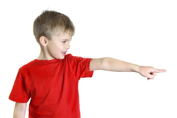 Boy points his finger to the side — Stock Photo, Image