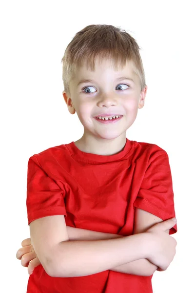 Boy stands and smiles, looks aside — Stock Photo, Image