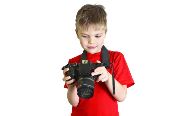 Boy looks at the photo on the camera — Stock Photo, Image