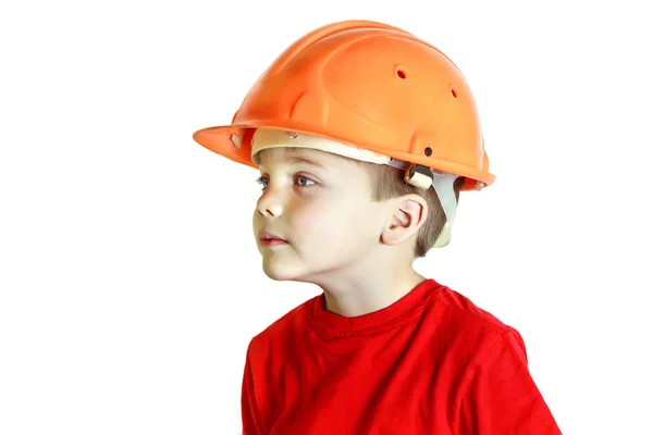 Little builder boy in the construction helmet — Stock Photo, Image