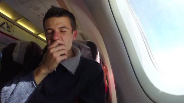 Yawning airplane passenger — Stock Video