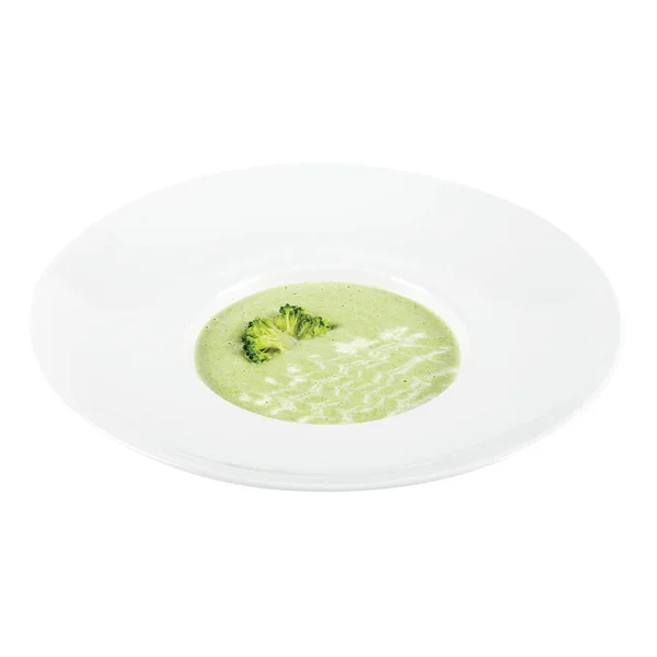 西兰花奶油酸汤 装在一个白色大盘中 在白色的背面隔开 — 图库照片