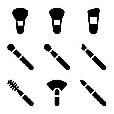 Güzellik ve kozmetik kavramları için siyah bir siluet tasarımı ile sunulan toz, fondöten, göz farı ve rimel çubuklarını içeren dokuz farklı makyaj fırçası ikonu..