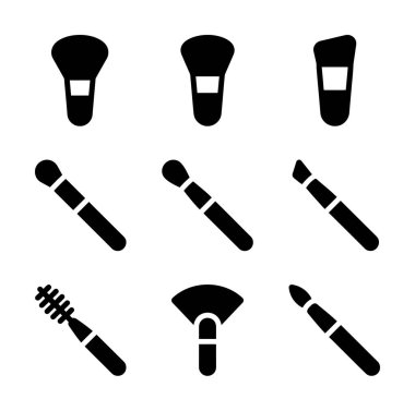 Değişik makyaj fırçalarını temsil eden dokuz adet koyu siyah kabartma simgesinden oluşan bir koleksiyon. Bu set toz, temel, göz farı ve rimel uygulaması için araçları içerir.