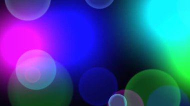 Renkli, odaksız, mavi, yeşil ve morumsu bokeh ışıkların yer aldığı dinamik ve hareketli bir arka plan..