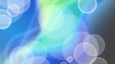 Rüya gibi mavi ve yeşil bir arkaplanda yüzen bokeh ışık parçacıkları ve yumuşak daireler içeren soyut animasyon. Sakinleştirici ve ruhsal hareket grafik döngüsü.