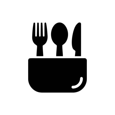 Bir tutacağa çatal kaşık ve bıçak yerleştirilmiş bir alet takımı.