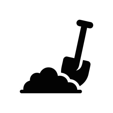 Kürek, bahçe işleri veya inşaat işlerini temsil eden zengin toprak yığınını eşeliyor