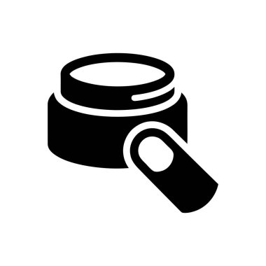 Krema kavanozu ve parmağını kozmetik ürünlere daldırmak güzellik ve cilt bakımı uygulamasını temsil ediyor