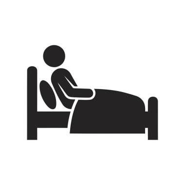 Hasta bir hastane yatağında dinleniyor ve iyileşme gösteriyor.