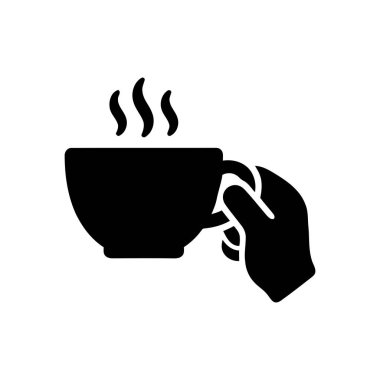 Sıcak bir bardakta sıcak bir içecek, sıcak ve konforlu olması için yükselen bir buhar.