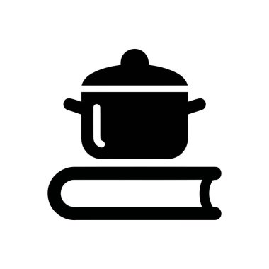 Yemek pişirme eğitimi konsepti, yemek tarifleri için bir kitabın üzerinde duran kapağı olan bir çömleği gösteriyor.