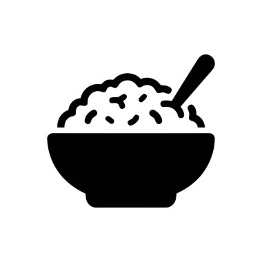 Bowl filled with a delicious meal and a spoon is ready for eating