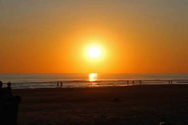 Colorful sunset on the shore of the ocean