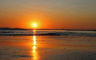 Colorful sunset on the shore of the ocean