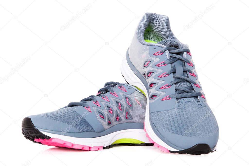 Pair of colored sport shoes on white background. 