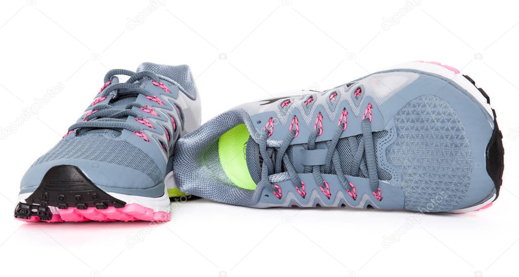 Pair of colored sport shoes on white background. 