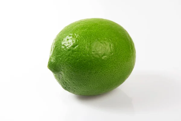 Whole Green Lemon White Background — Stock Photo, Image