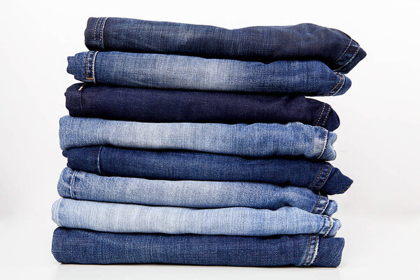 Fashionable clothes.  Jeans on white  background.