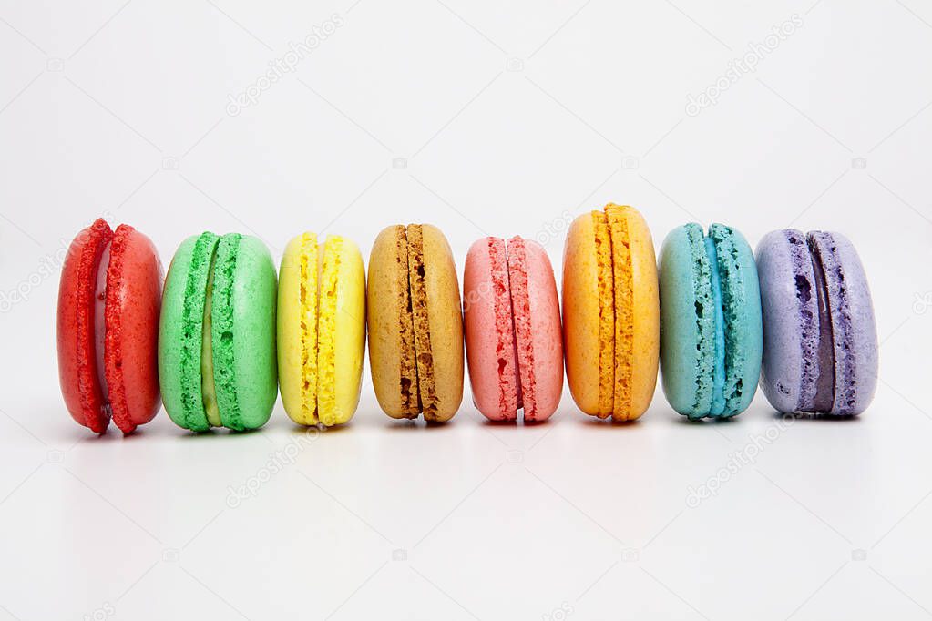 Sweet and colorful macaron on white background. Sweet snacks.