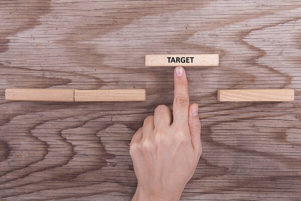 Business woman is working with wooden blocks in the office.