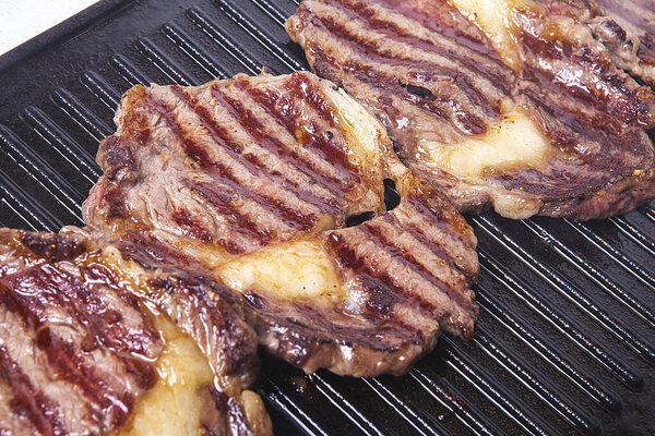 Beef steak cooked on the grill. Roast beef.