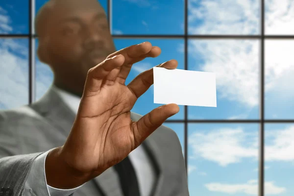 Afro manager shows ID card. — Stock Photo, Image