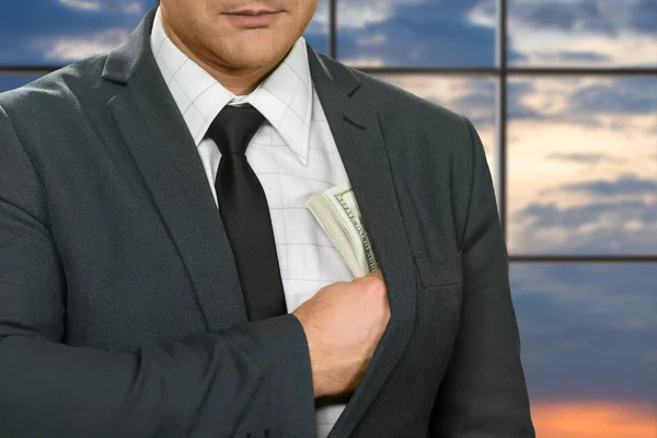 Office administrator hides dollars. — Stock Photo, Image