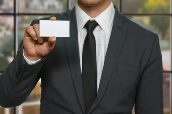 Office manager shows visit card. — Stock Photo, Image