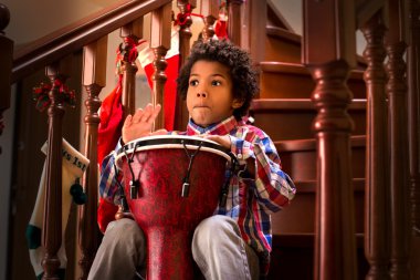 Young drum player is scared. clipart
