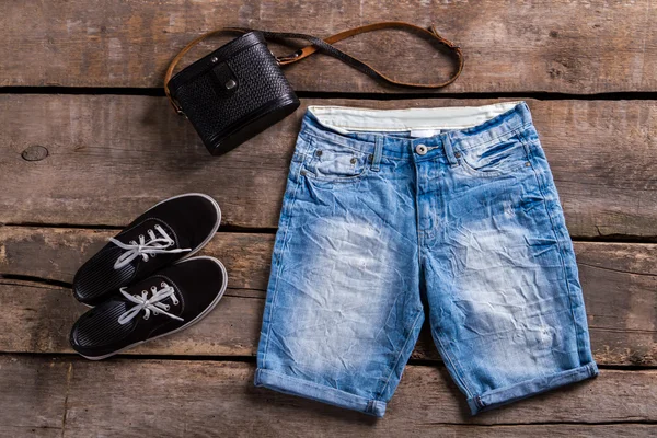 Ladys long blue denim shorts. — Stock Photo, Image