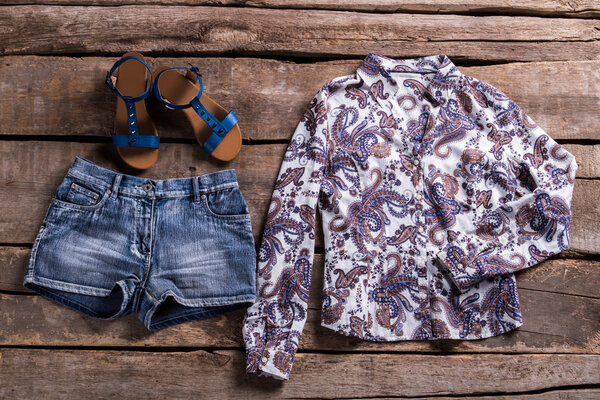 Shorts with sandals and shirt.