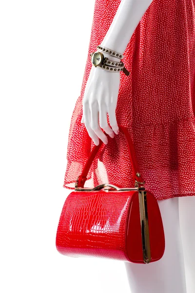 Red purse in mannequins hand. — Stock Photo, Image