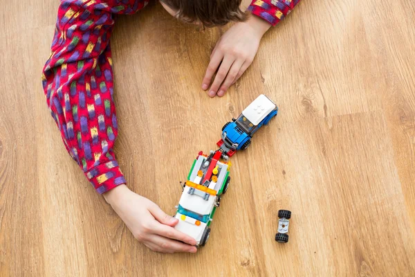 Child playing with toy truck. — Stock Photo, Image