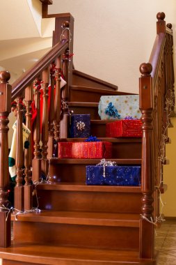 Gift boxes laying on stairs. clipart