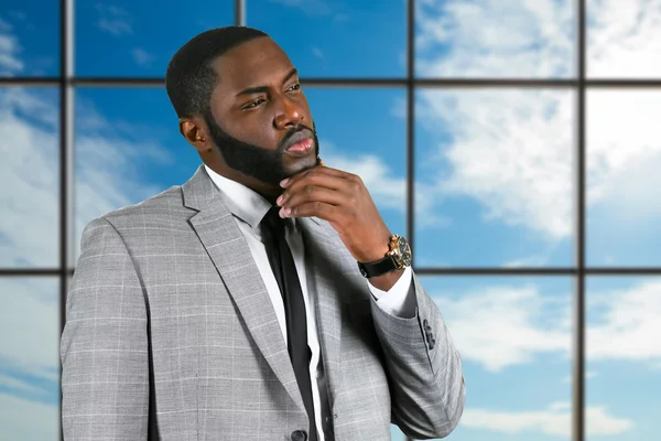 Thoughtful black businessman in suit. — Stock Photo, Image