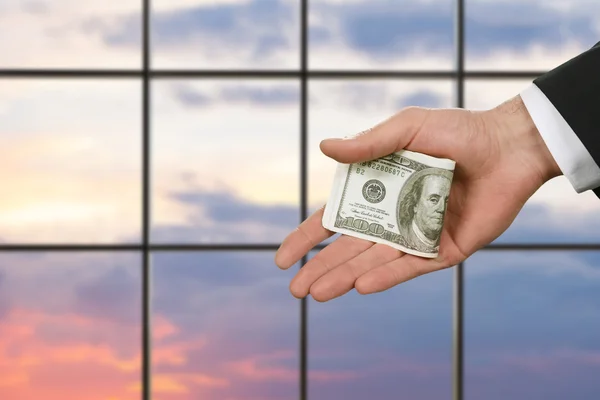 Businessmans hand holding cash. — Stock Photo, Image